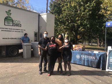 Group of people standing in front of the Eco-Shred mobile Shredding Truck at one of the Shred Events